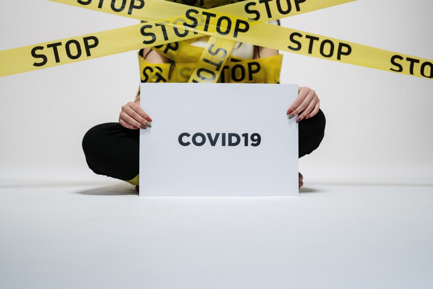 person-holding-covid-sign-3951600