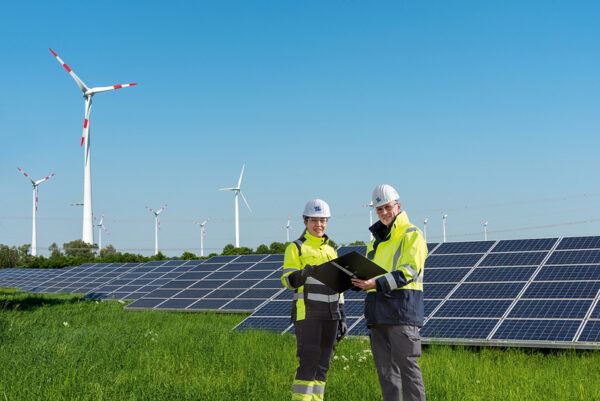 Wind engines and solar panels on a sunny day - Uniper SE
